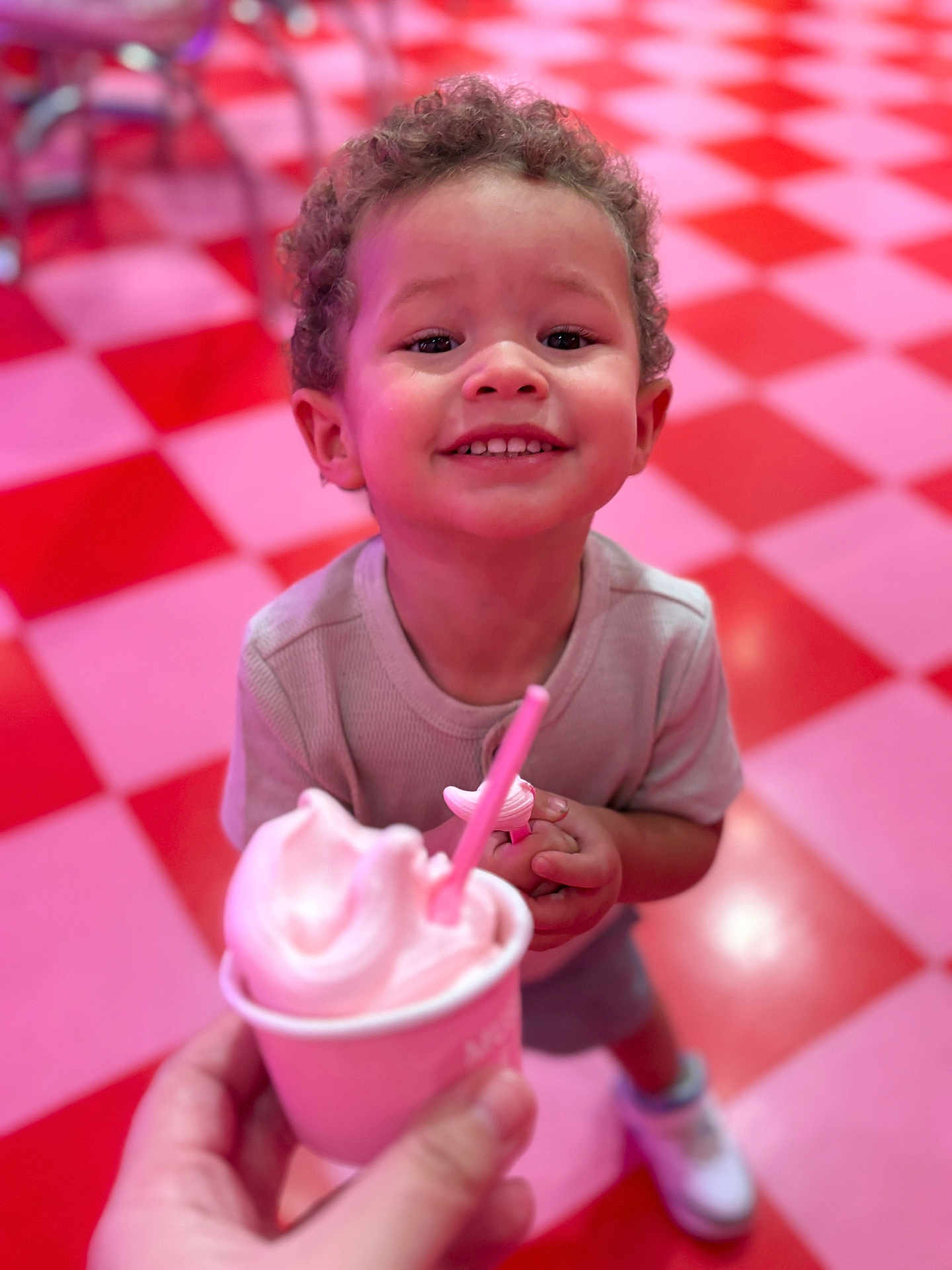 Dashane joined the competition — help win amazing prizes! child, toddler, smiling, curly_hair, ice_cream, cup, pink, floor, checkered_floor, red, pink_floor, shoes, clothing, indoor, person, happy, food, dessert, hand, closeup