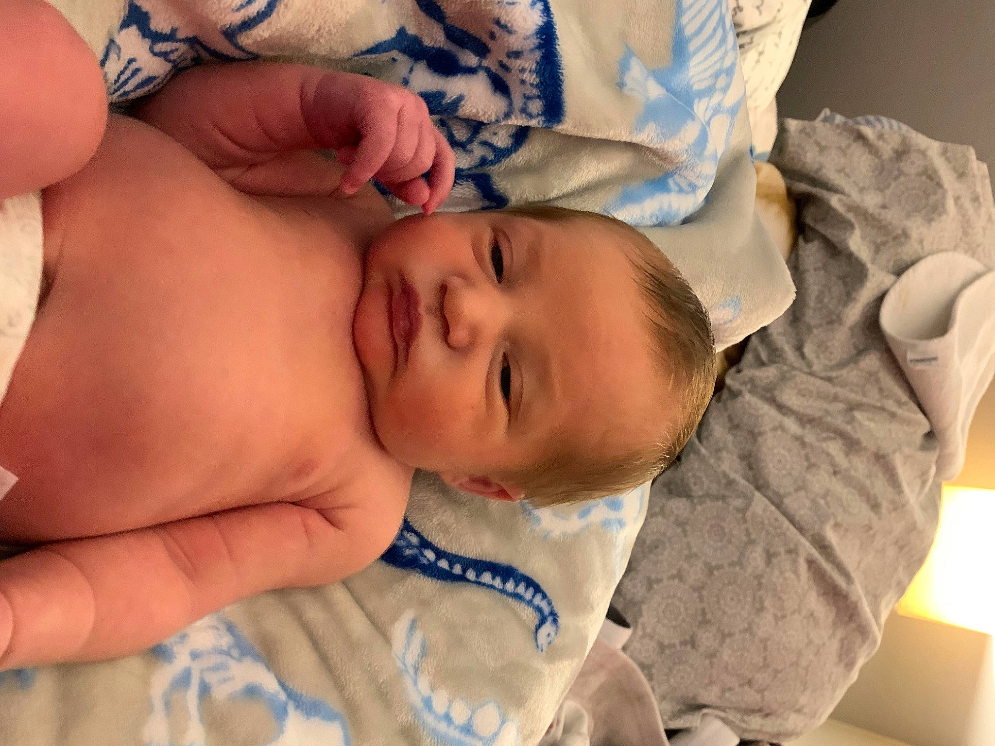 Xander is registered to the contest to win money with this photo: baby, baby_toddler_clothing, cheek, chest, child, comfort, eye, eyelash, finger, gesture, glasses, hand, happy, iris, lip, mouth, nose, person, skin, thumb