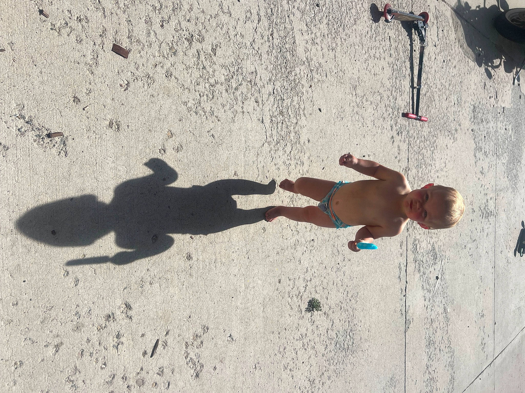 Madison joined the competition — help win amazing prizes! art, asphalt, barechested, beach, child, concrete, elbow, fun, hat, human_leg, landscape, leg, person, recreation, sand, shadow, soil, swimwear, thigh, toddler