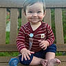 baby, child, smiling, bench, wood, outdoor, pacifier, barefoot, striped_shirt, navy_shorts, cute, happy, person, sitting, face, young_child, nature, greenery, daylight, portrait