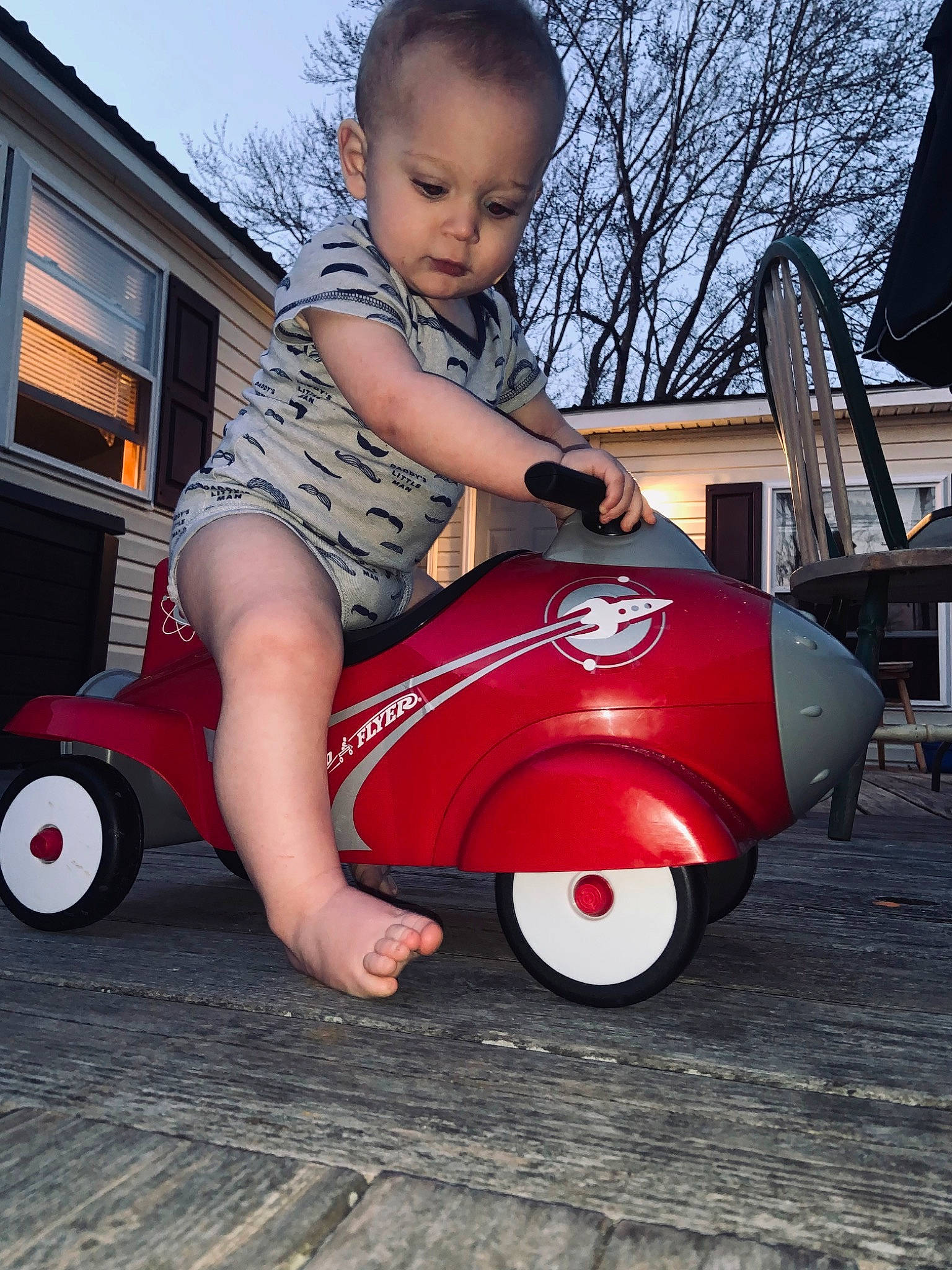 Xavier is registered to the contest to win money with this photo: automotive_design, automotive_tire, automotive_wheel_system, fender, grass, leg, mammal, mode_of_transport, motor_vehicle, person, product, riding_toy, rolling, shoe, sky, tire, toddler, tree, vehicle, wheel