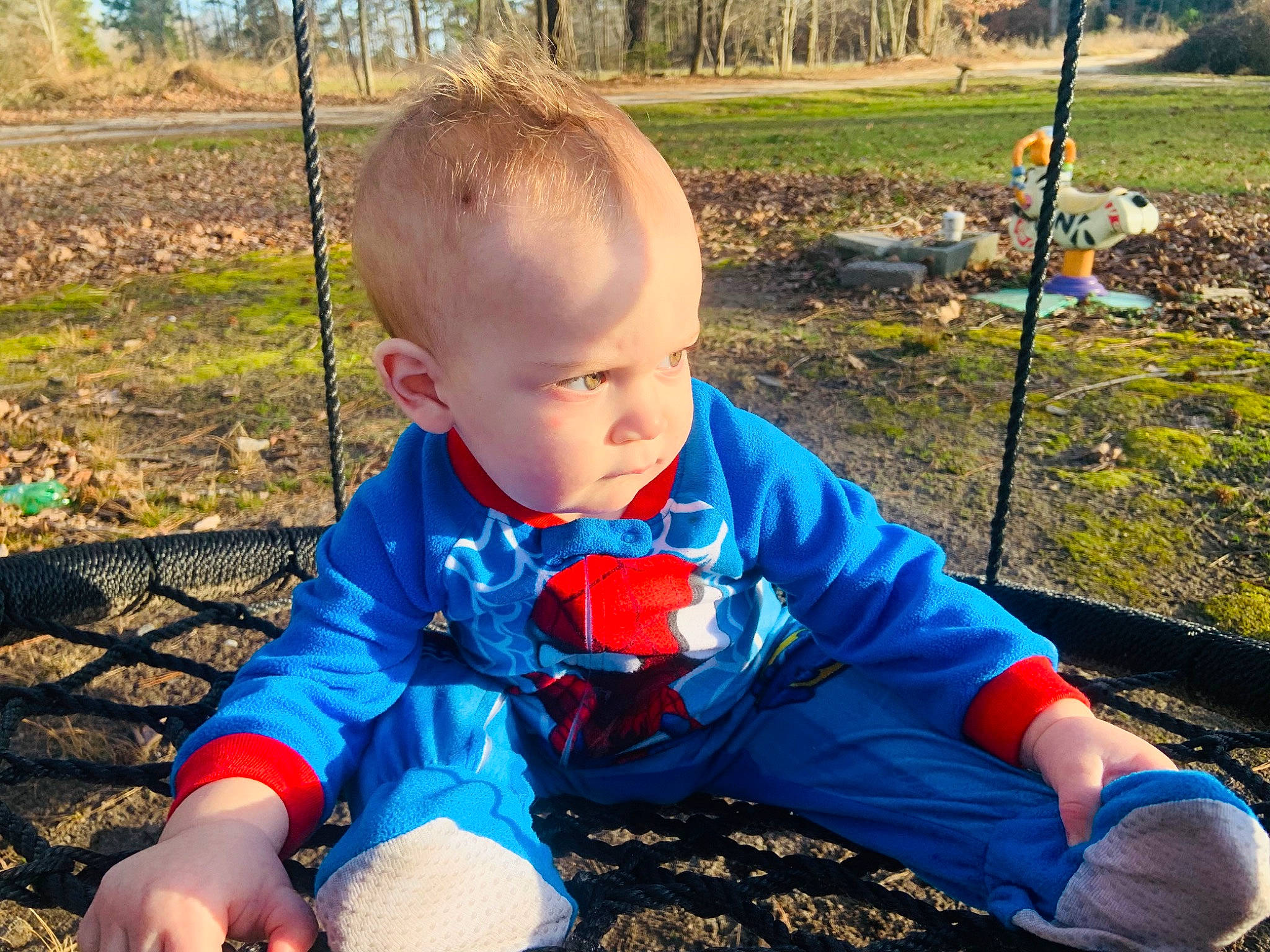 Xavier is registered to the contest to win money with this photo: baby, baby_toddler_clothing, child, electric_blue, fun, grass, hairstyle, happy, leaf, leisure, people_in_nature, person, photograph, plant, public_space, recreation, sitting, soil, summer, toddler