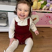 Arabella Grace is registered to the contest to win money with this photo: bodypart, child, clothing, couch, face, female, footwear, furniture, girl, happy, head, hosiery, person, photography, portrait, shoe, sitting, smile, sock, wood