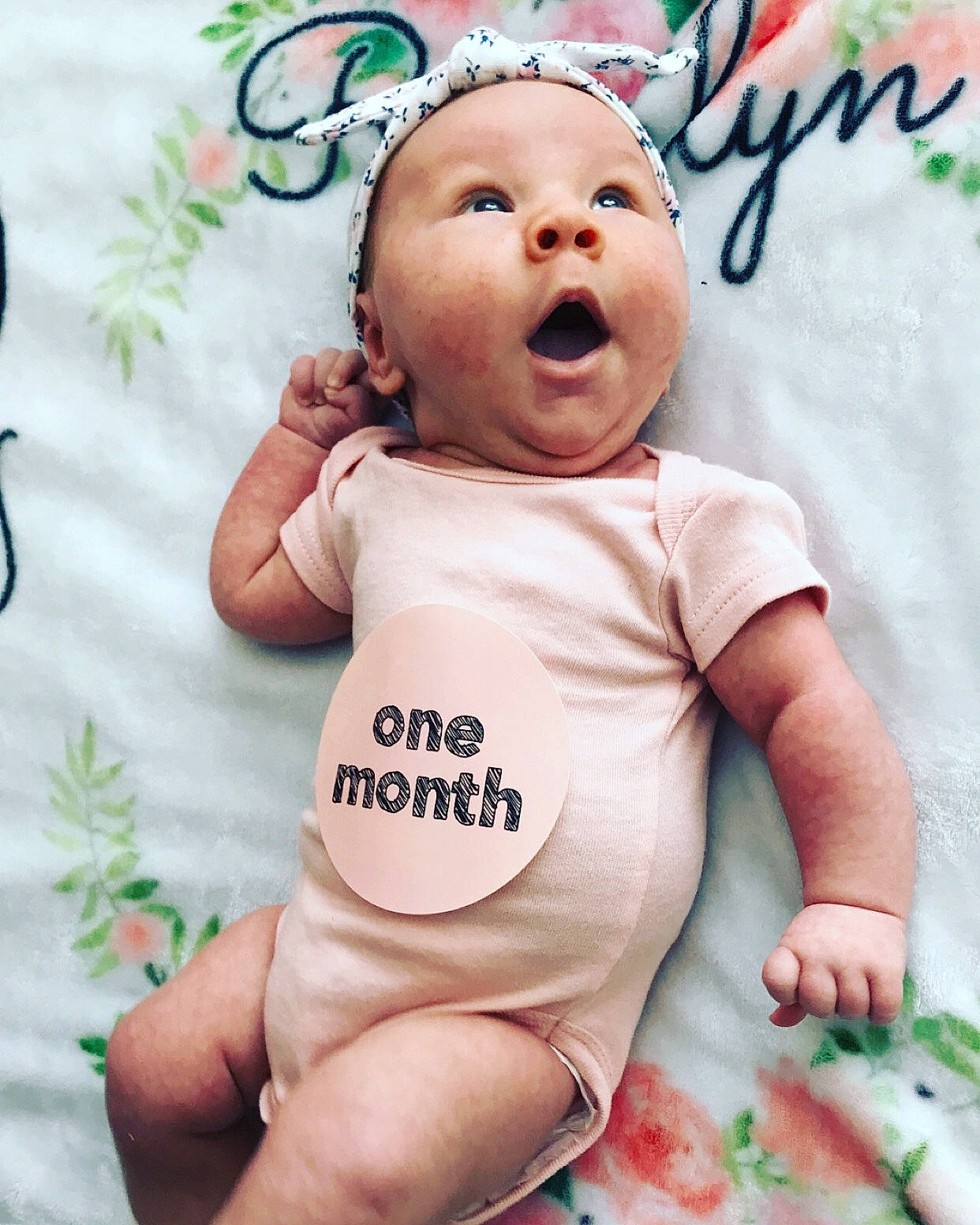 Riverlyn is registered to the contest to win money with this photo: baby, baby_laughing, baby_making_funny_faces, baby_products, baby_toddler_clothing, cheek, child, cool, facial_expression, font, happy, head, headwear, nose, person, photo_caption, pink, product, sleeve, smile