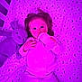 baby, bottle, crib, plush_bunny, sleepwear, child, blue_eyes, sheet, pattern, moon, stars, lying_down, indoor, toy, feeding, cute, infant, sleepy, purple_lighting, cozy