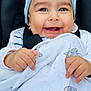 baby, smile, blanket, blue_hat, elephant_print, happy, child, infant, cute, hands, close_up, face, cheeks, clothing, car_seat, portrait, adorable, warm, baby_girl, baby_boy
