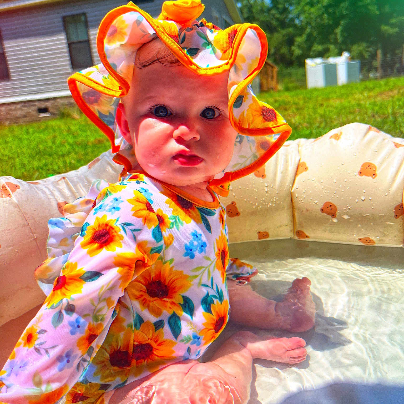 Lillian joined the competition — help win amazing prizes! architecture, baby, bonnet, building, clothing, costume, dress, face, grass, hat, head, outdoors, person, photography, plant, pool, portrait, shelter, summer, water