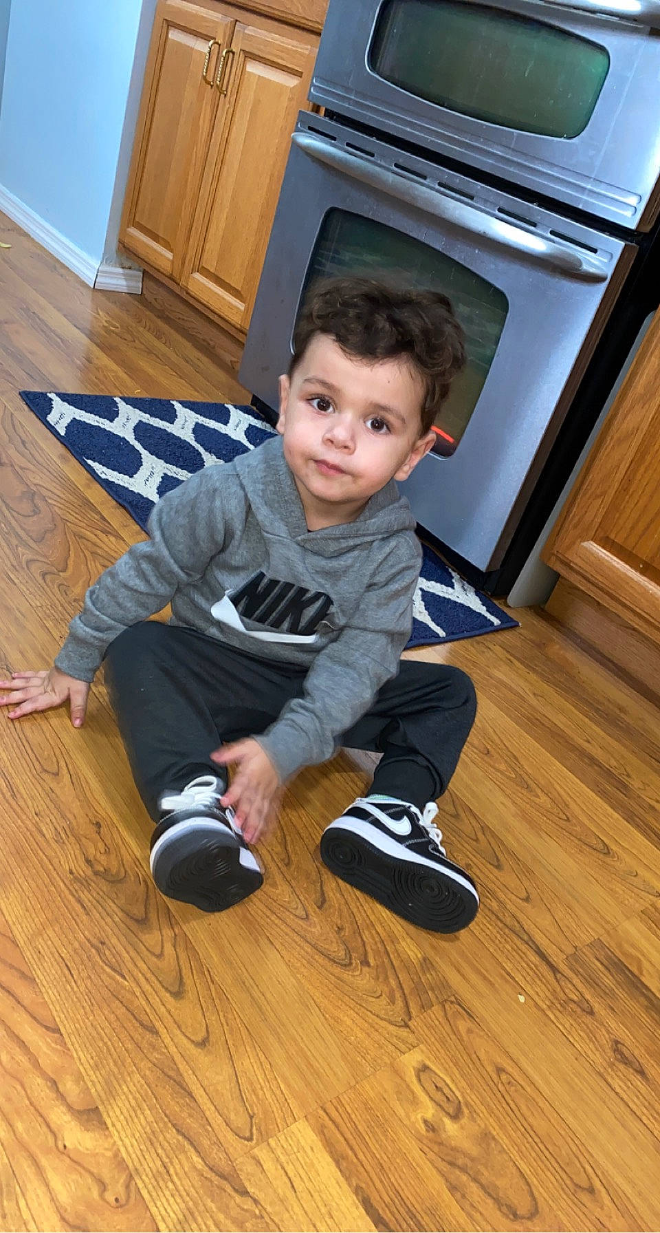 Aj joined the competition — help win amazing prizes! baby_toddler_clothing, child, floor, flooring, happy, hardwood, laminate_flooring, leg, person, room, shoe, sitting, sleeve, sneakers, standing, t_shirt, toddler, varnish, wood, wood_flooring