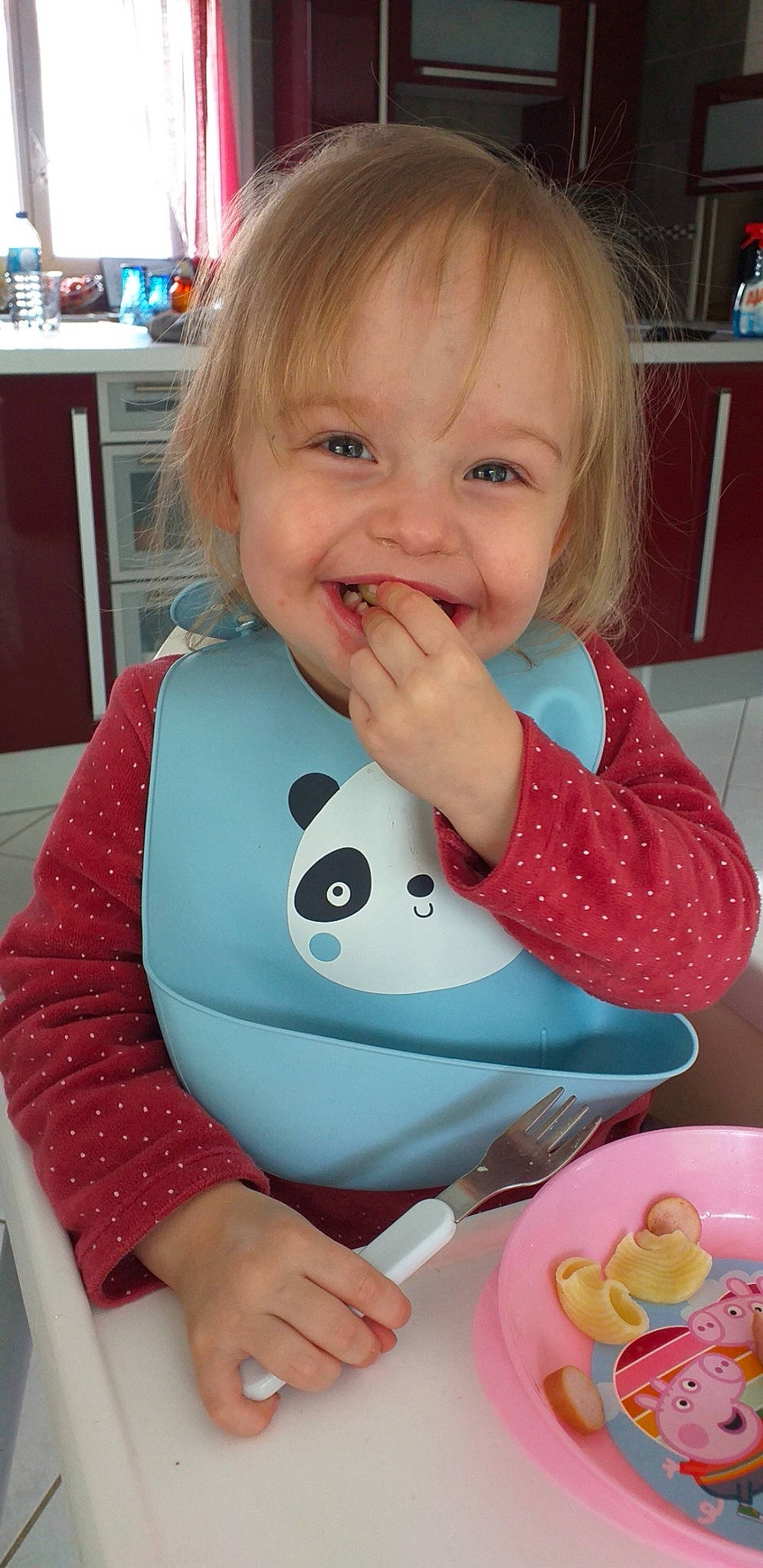 Inaya participe au concours pour gagner de l'argent avec cette photo : baby, baby_products, baby_toddler_clothing, blond, blue, cabinetry, cheek, child, eye, fun, happy, human_body, joy, pattern, person, pink, sitting, skin, sleeve, smile