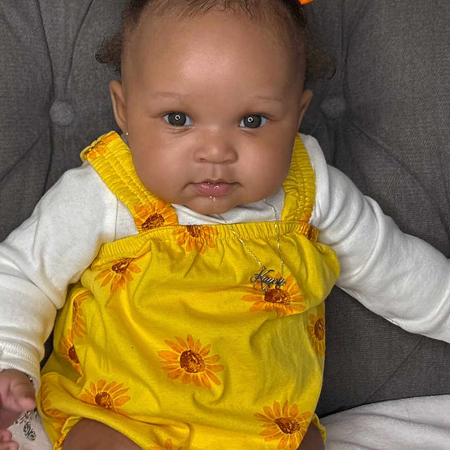 Kayori is registered to the contest to win money with this photo: baby, bodypart, clothing, couch, face, finger, flower, frown, furniture, hand, happy, head, newborn, person, photography, plant, portrait, sad, sitting, smile