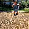 Kobe joined the competition — help win amazing prizes! toddler, child, swing, playground, sunny, daytime, smiling, happy, outdoor, grass, woodchips, chains, blue_sky, house, bushes, shadow, clothing, shoes, person, fun