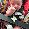 baby, infant, child, sleeping, face, portrait, car_seat, harness, safety_strap, pacifier, sock, blanket, red, patterned, seated, close_up, indoor, transportation, cute, photography