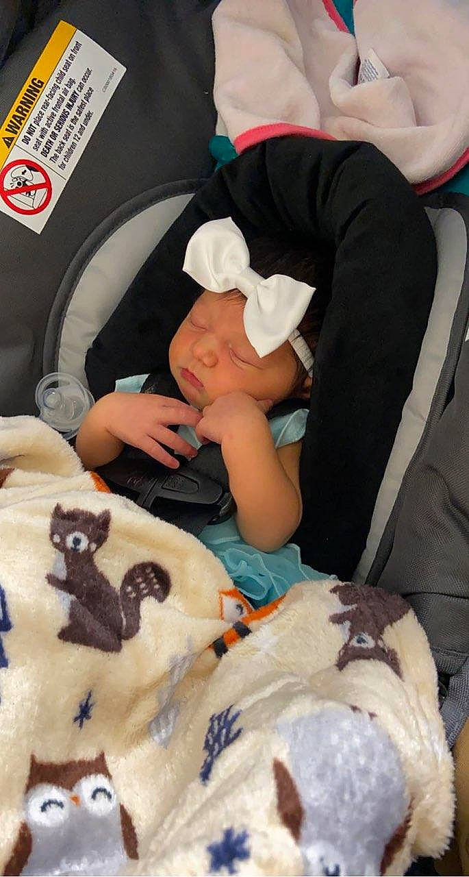 Tymber is registered to the contest to win money with this photo: baby, baby_products, bed, bedding, car_seat, child, comfort, felidae, fur, hat, headwear, lap, linens, nail, nap, people, person, room, stuffed_toy, t_shirt