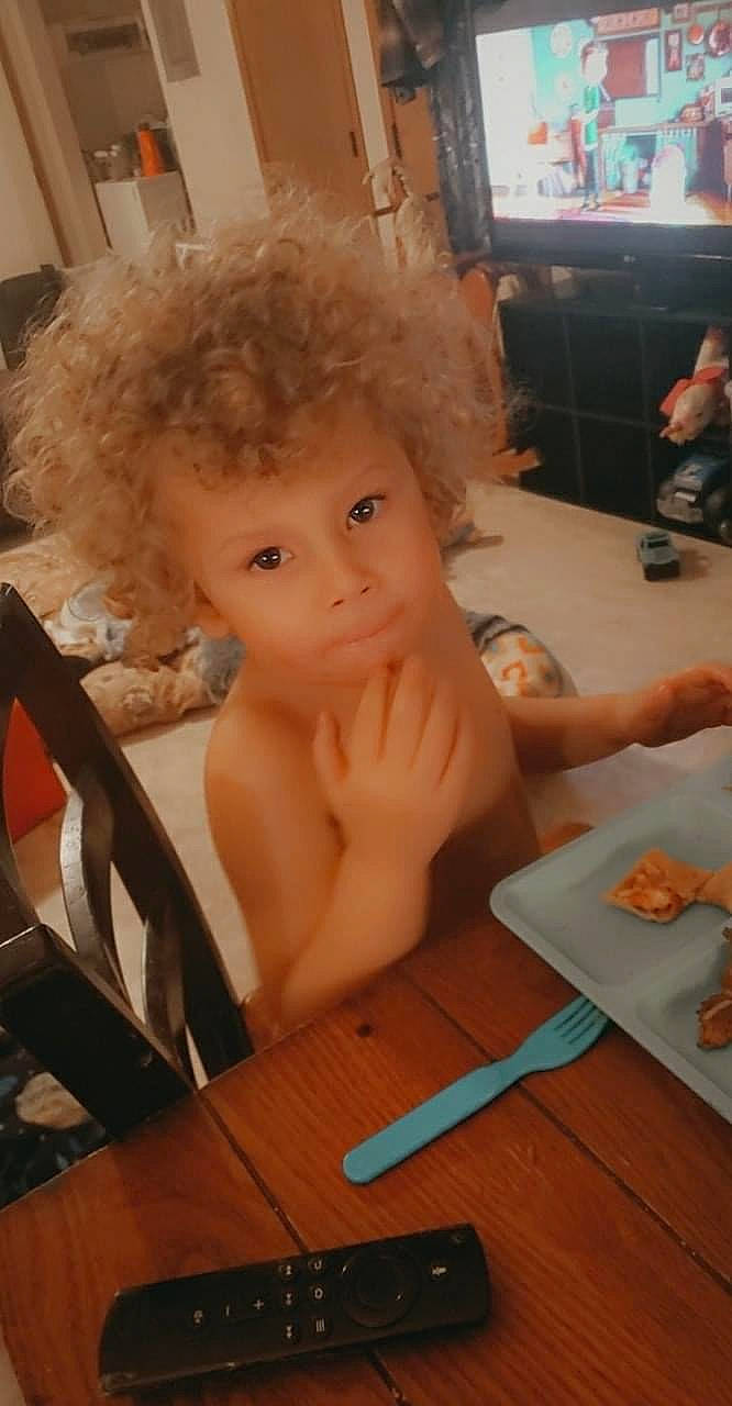 Santana joined the competition — help win amazing prizes! afro, chair, child, comfort_food, eye, eyebrow, finger, flooring, fun, lip, mouth, nose, person, plate, room, skin, table, tableware, television, toddler