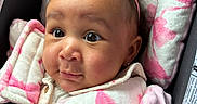 Nyava joined the competition — help win amazing prizes! baby, child, car_seat, pink, headband, flower, infant, face, straps, seatbelt, cute, closeup, portrait, padded, clothing, sitting, young, looking, indoors, safety