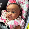 baby, child, car_seat, pink, headband, flower, infant, face, straps, seatbelt, cute, closeup, portrait, padded, clothing, sitting, young, looking, indoors, safety