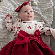 Elena a rejoint le concours — aidez-le/la à gagner de superbes lots ! adorable, baby, bassinet, blanket, blue_eyes, bow, clothing, headband, heart_pattern, indoor, infant, lying_down, pacifier, plush_toy, portrait, red_dress, rosy_cheeks, ruffled_sleeves, soft_texture, towel