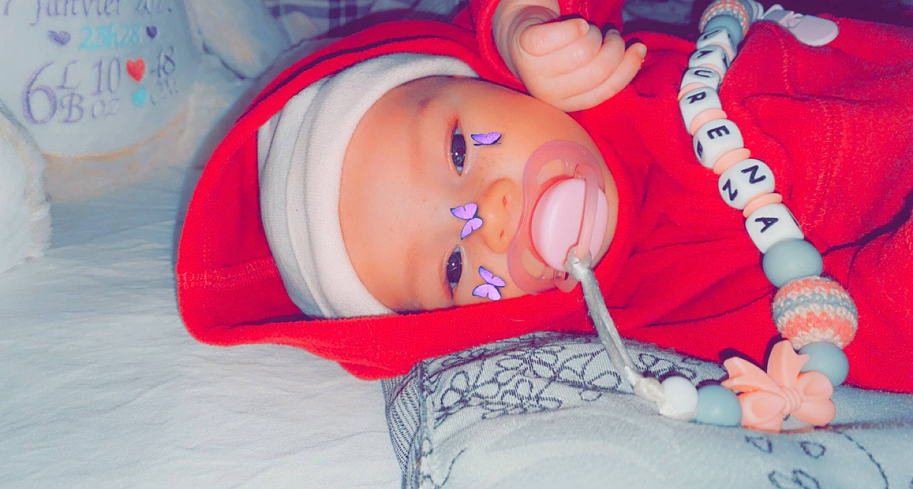 Laurena participe au concours pour gagner de l'argent avec cette photo : arm, baby, baby_sleeping, baby_toddler_clothing, comfort, eye, finger, hand, hat, headgear, headwear, human_body, leg, mouth, orange, person, pink, red, skin, textile