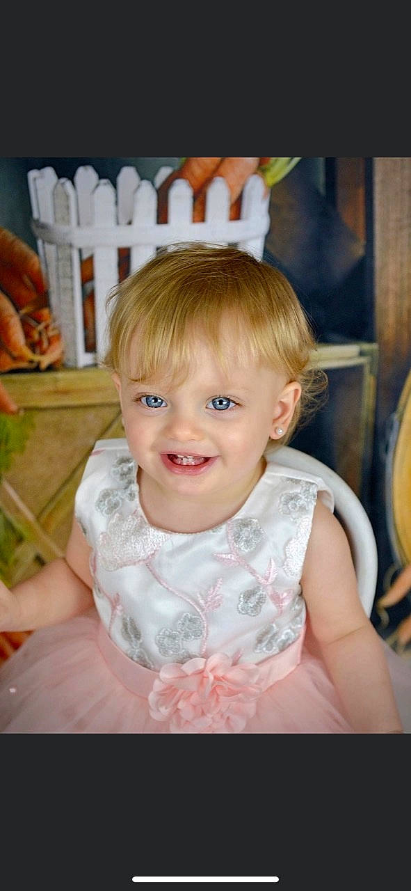 Aiva joined the competition — help win amazing prizes! baby, baby_toddler_clothing, bangs, blond, chair, cheek, child, dress, eye, fun, happy, head, iris, joy, person, product, room, sitting, skin, smile