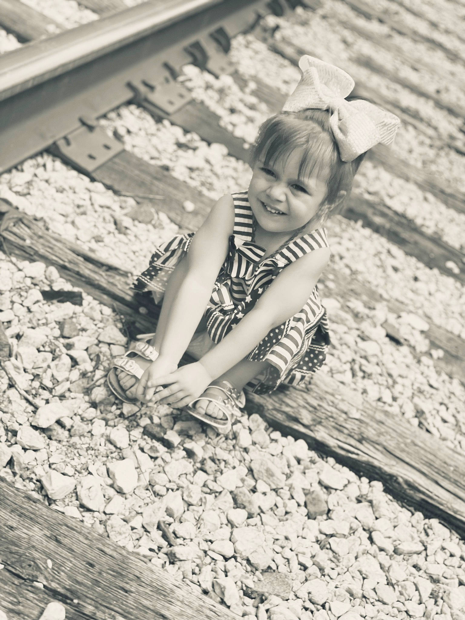 Pyper Rose is registered to the contest to win money with this photo: black_and_white, cobblestone, flash_photography, flooring, fun, grass, happy, human_leg, joy, leisure, monochrome, monochrome_photography, people_in_nature, person, rock, sitting, snapshot, soil, stock_photography, style
