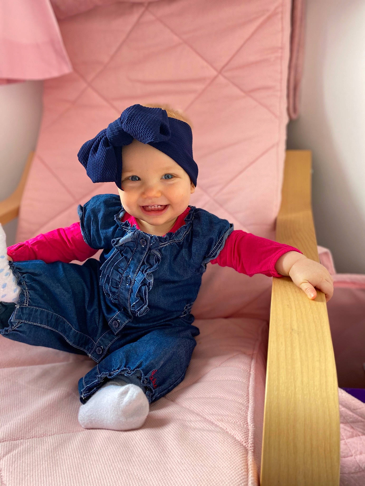 Elsie is registered to the contest to win money with this photo: baby_toddler_clothing, cap, child, comfort, electric_blue, eye, fun, hairstyle, happy, headwear, human_leg, joy, lap, leisure, magenta, person, purple, recreation, sitting, skin