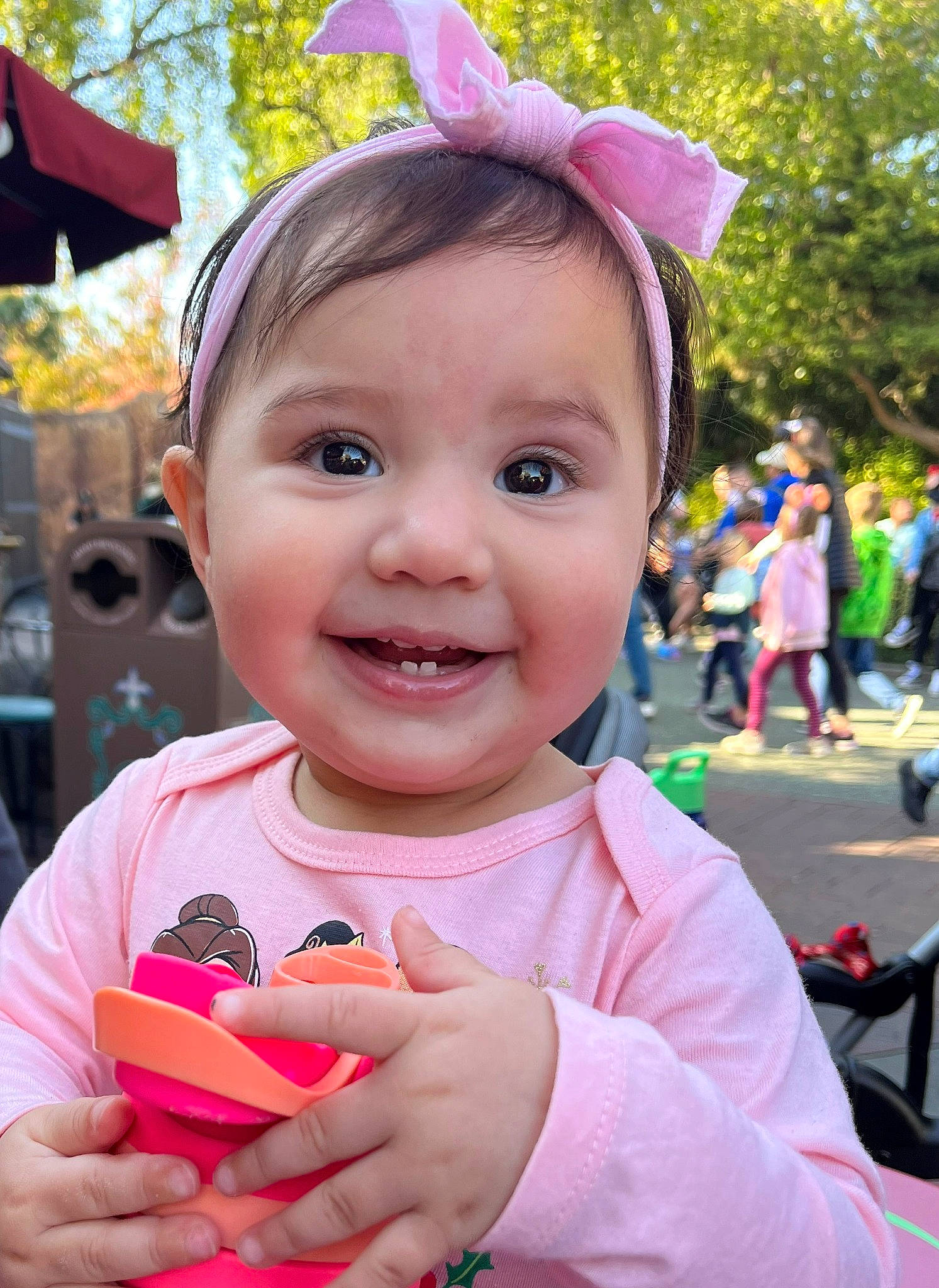 Olivia is registered to the contest to win money with this photo: child, costume_hat, event, fashion_accessory, fun, happy, headband, joy, leisure, lip, magenta, nail, person, pink, recreation, skin, smile, summer, toddler, tree