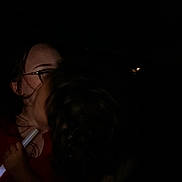 Elijah joined the competition — help win amazing prizes! child, person, glasses, darkness, night, stick, holding, face, hair, closeup, embrace, red_clothing, illumination, shadow, outdoor, intimacy, parent, childhood, together, love