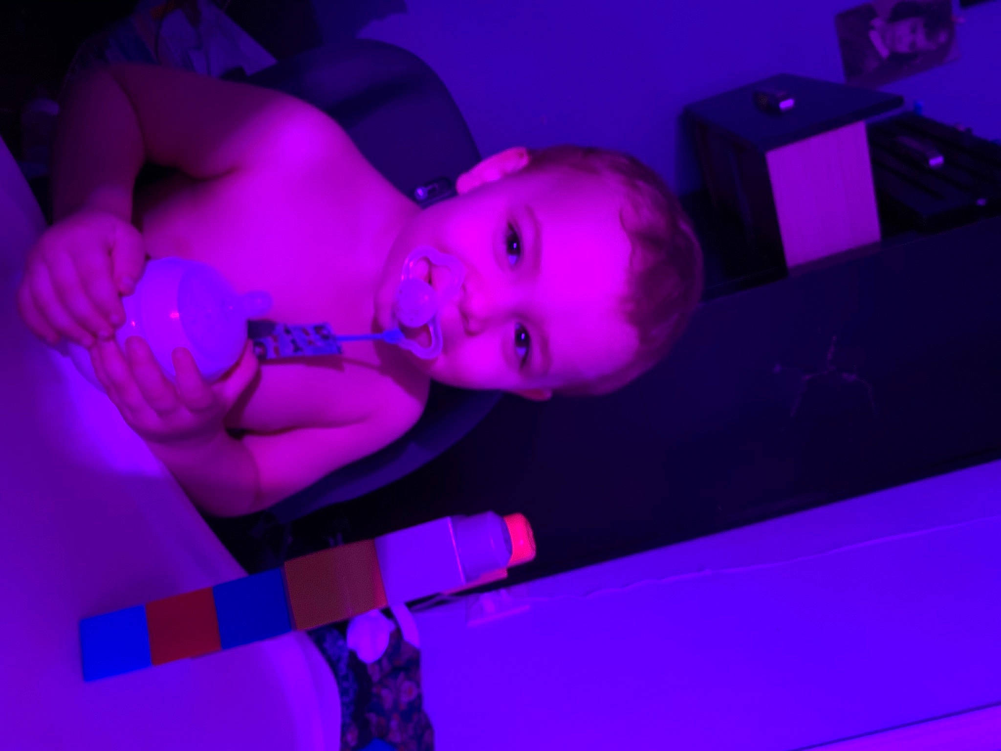 Landon is registered to the contest to win money with this photo: animation, elbow, electric_blue, entertainment, event, flash_photography, fun, hat, human_body, magenta, music, performance, performance_art, performing_arts, person, pink, plant, public_event, purple, under_exposed