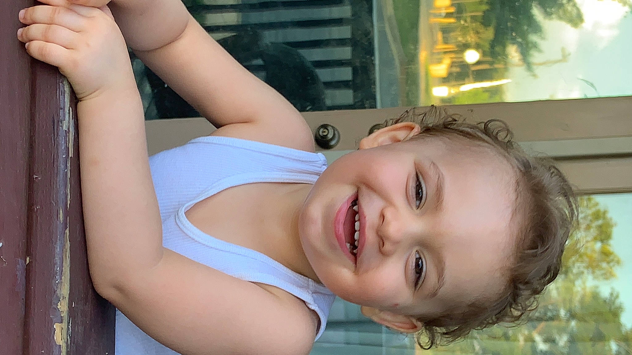 Landon is registered to the contest to win money with this photo: arm, chin, dress, eyelash, face, gesture, happy, human_body, joy, lip, mouth, muscle, neck, person, photograph, plant, shoulder, skin, smile, sunlight