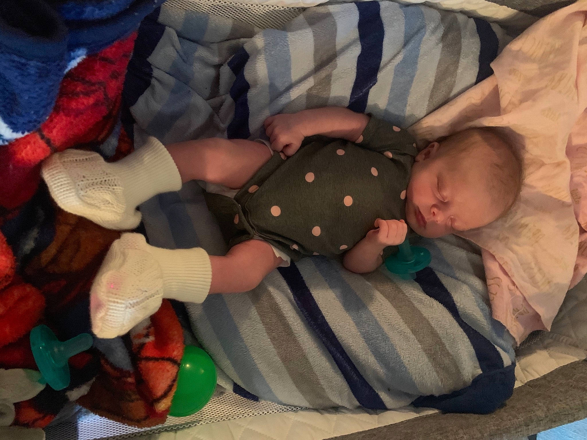 Charlotte is registered to the contest to win money with this photo: baby, baby_products, baby_sleeping, baby_toddler_clothing, bedtime, child, comfort, finger, hand, human_body, human_leg, lap, leg, linens, mammal, pattern, person, sock, textile, thumb