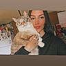 Mia joined the competition — help win amazing prizes! appliance, black_clothing, blue_eyes, cabinet, cat, domestic_animal, face, feline, holding, home, indoor, kitchen, long_hair, person, pet, portrait, refrigerator, smile, tattoo, woman