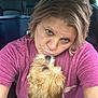 woman, dog, car, pet, affection, cute, fluffy_dog, casual_clothing, indoor, portrait, love, human, animal, seat, seatbelt, hairstyle, closeup, interaction, expression, transportation