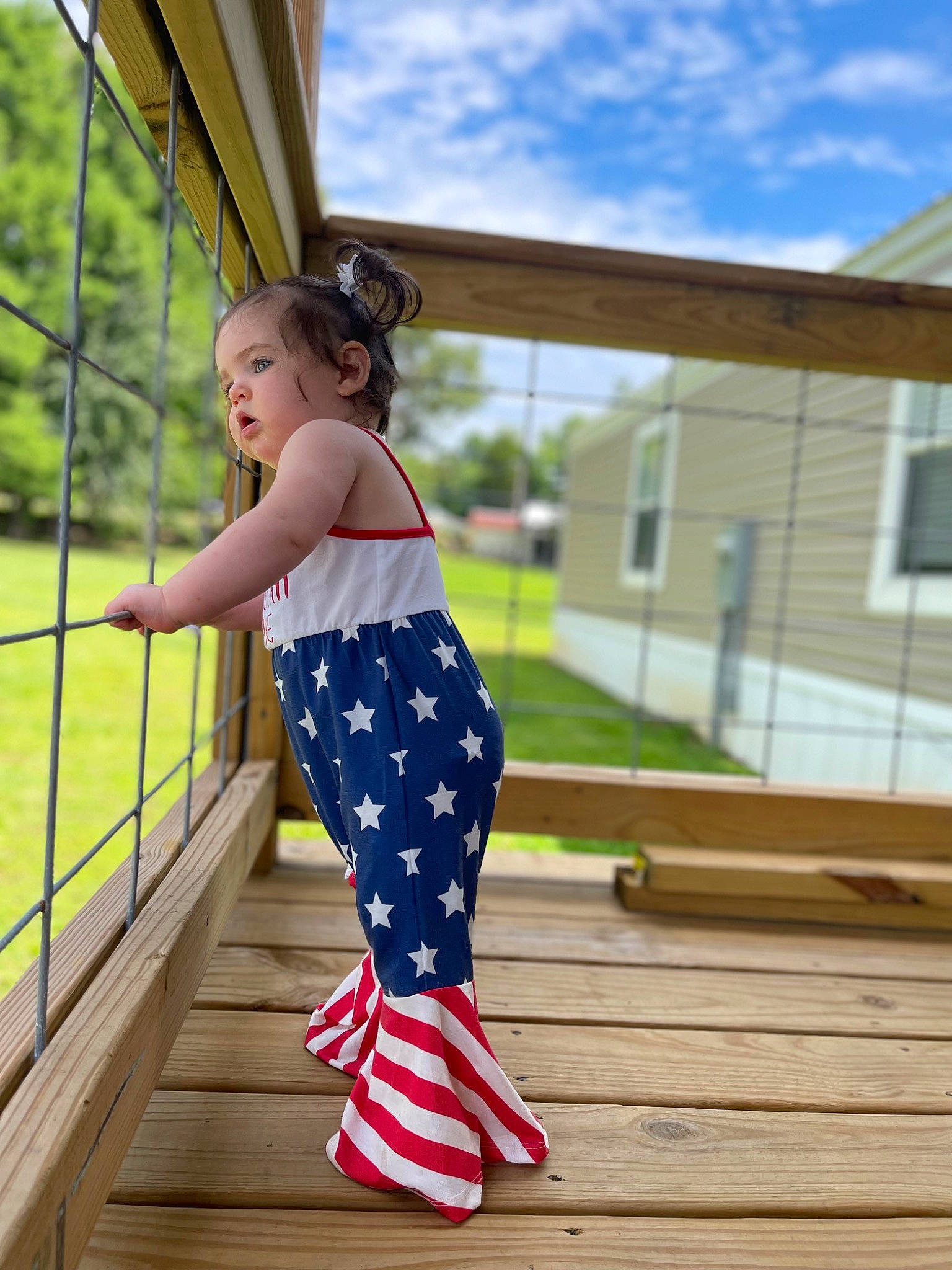 Kyndall is registered to the contest to win money with this photo: child, city, cloud, electric_blue, fun, happy, human_leg, knee, leisure, pattern, person, plant, polka_dot, recreation, sitting, sky, thigh, toddler, tree, waist