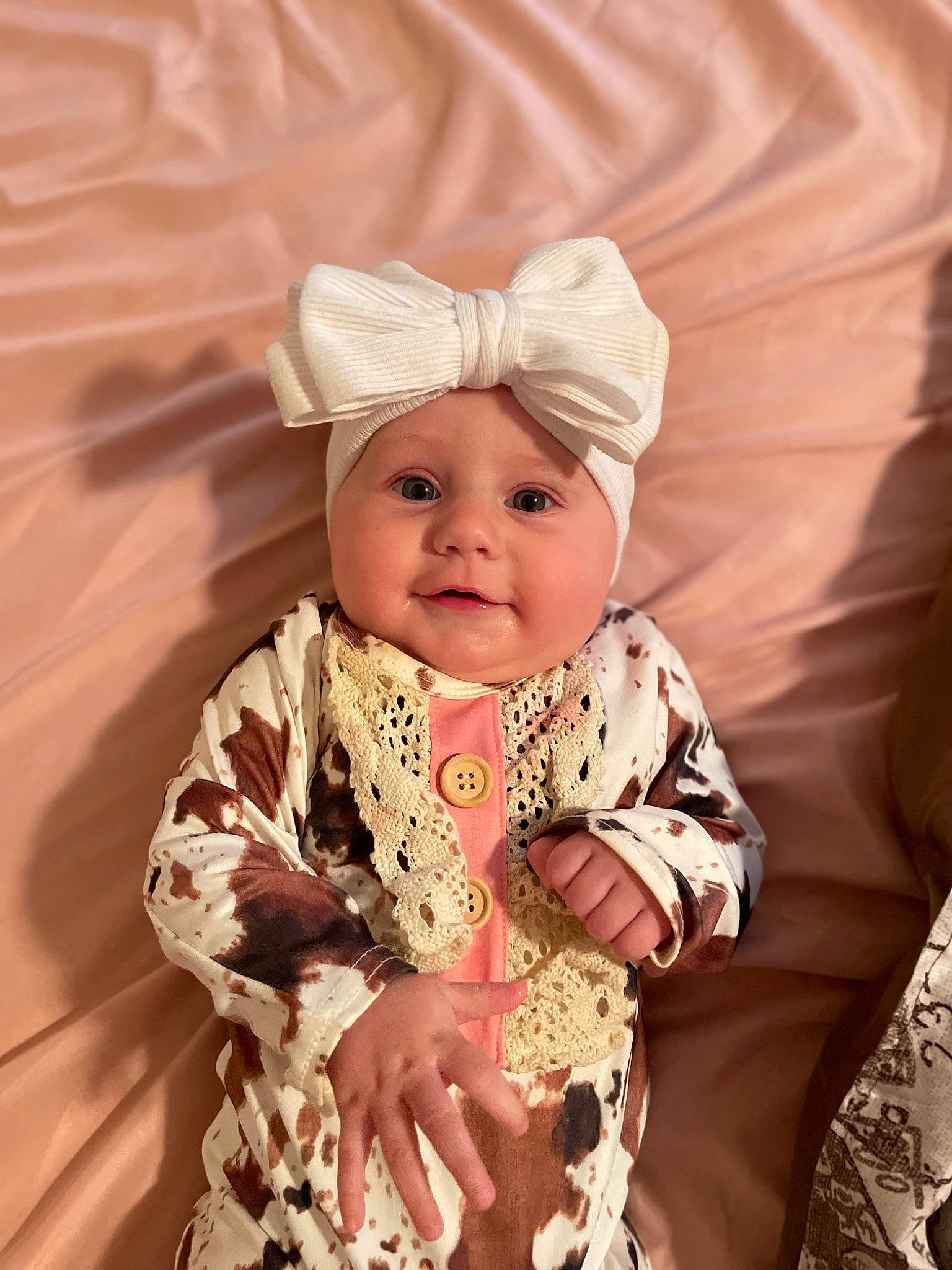 Emery is registered to the contest to win money with this photo: baby, baby_toddler_clothing, child, comfort, costume_hat, embellishment, eye, fashion_accessory, fun, hair_accessory, happy, head, headband, headwear, joy, pattern, peach, person, pink, skin