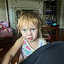 Riley joined the competition — help win amazing prizes! toddler, child, messy_hair, blue_eyes, tank_top, living_room, fireplace, television, furniture, pink_chair, wooden_floor, person, indoors, curious_expression, colorful_clothing, home, casual, young_child, cute, childhood