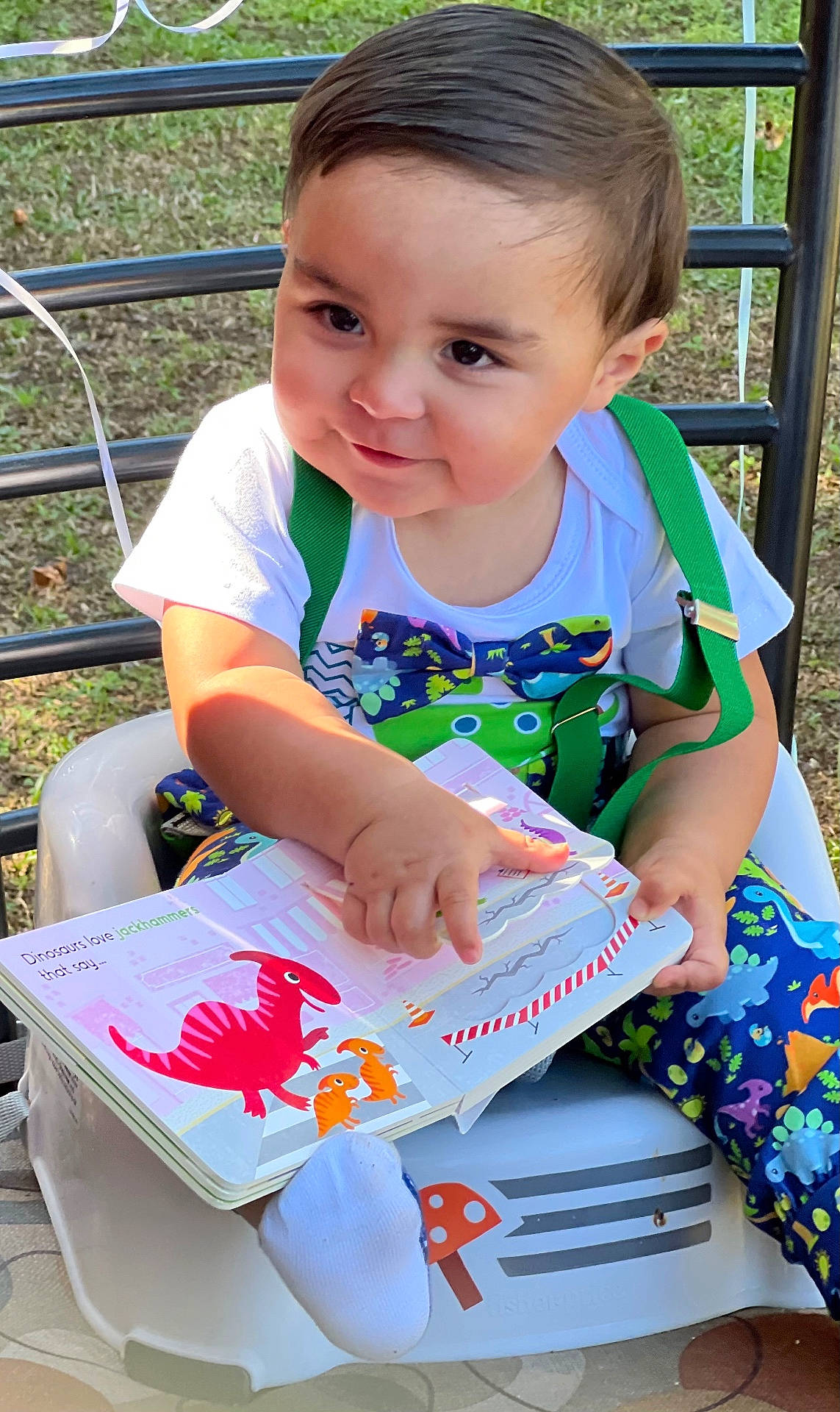Brantley joined the competition — help win amazing prizes! book, boy, child, clothing, face, grass, head, male, nature, outdoors, park, person, photography, plant, portrait, publication, reading, sitting, summer, t_shirt