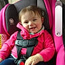 child, toddler, baby, smiling, happy, face, portrait, car, car_seat, safety_harness, pink, jacket, clothing, seated, passenger, vehicle, interior, road_trip, social_media, photography