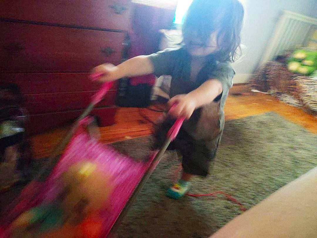 Atreus joined the competition — help win amazing prizes! child, floor, flooring, foot, fun, happy, hardwood, human_leg, leg, leisure, long_hair, magenta, person, plant, play, room, sitting, thigh, toddler, visual_arts