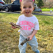Sienna Mae joined the competition — help win amazing prizes! toddler, child, grass, outdoor, stick, pink_bow, jeans, white_shirt, smiling, happy, blue_eyes, pigtails, nature, daylight, car, tree, lawn, playful, person, casual_clothing