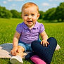 Anna participe au concours pour gagner de l'argent avec cette photo : baby, child, outdoor, grass, greenery, sky, clouds, purple_shirt, denim_shorts, smiling, sitting, toy, heart_shaped_pillow, pink_plush, sunny, daylight, happy, cute, nature, playful
