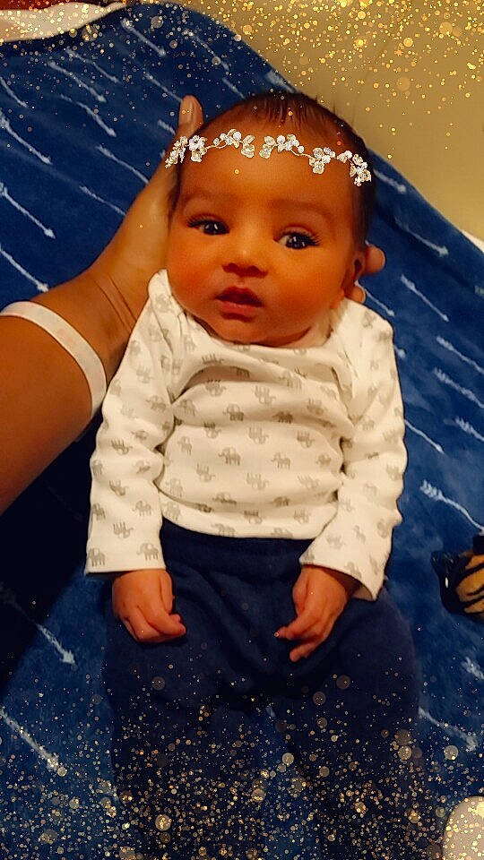 Maison is registered to the contest to win money with this photo: baby, blue, cheek, child, doll, forehead, hair_accessory, head, headgear, person, skin, toddler