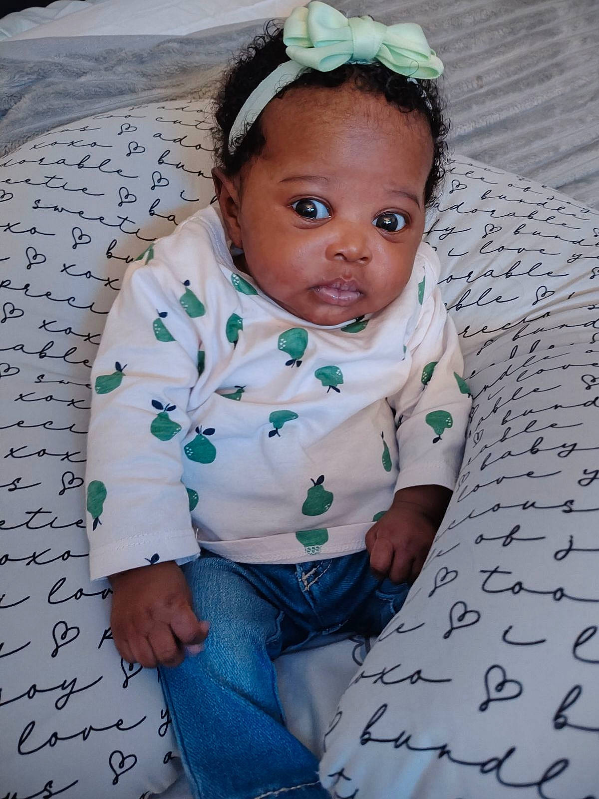 Nalani is registered to the contest to win money with this photo: adaptation, baby, baby_toddler_clothing, cheek, child, face, fashion_accessory, flash_photography, flooring, fun, grass, happy, head, headband, headpiece, pattern, person, portrait_photography, sitting, skin