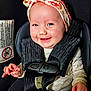 Jaymzi is registered to the contest to win money with this photo: baby, child, car_seat, headband, smile, harness, clothing, infant, seatbelt, child_safety, cute, person, happy, face, sitting, toddler, indoors, closeup, portrait, infant_clothing