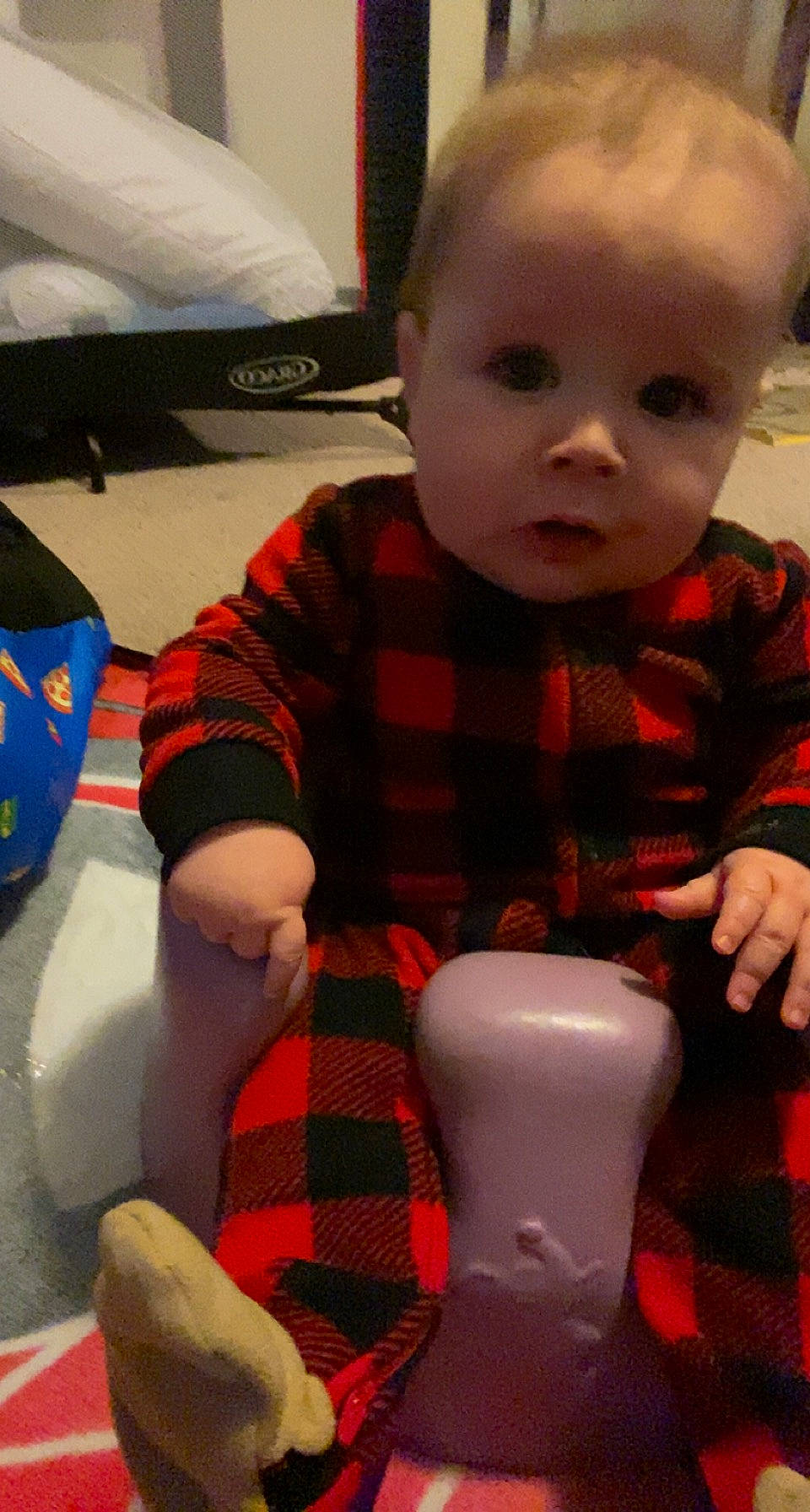Emerson joined the competition — help win amazing prizes! baby, baby_toddler_clothing, cheek, child, finger, flooring, fun, head, human_body, knee, lap, pattern, person, plaid, sitting, skin, sleeve, tartan, thigh, toddler