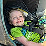 Arrow is registered to the contest to win money with this photo: toddler, child, car_seat, seatbelt, green_shirt, smile, happy, indoor, safety, clothing, person, baby, cute, car_interior, warning_label, seat, portrait, face, young_child, casual