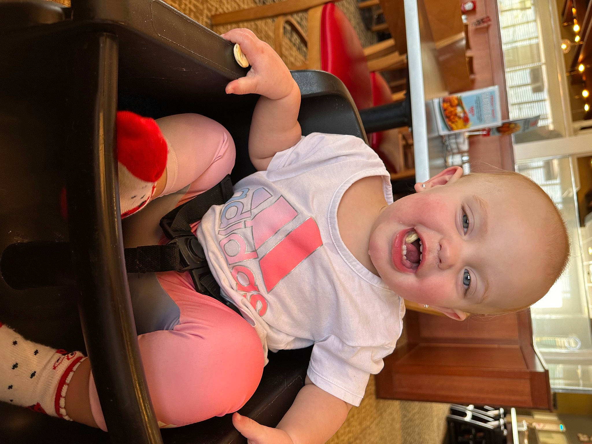 Bailee joined the competition — help win amazing prizes! baby, baby_products, baby_toddler_clothing, child, comfort, elbow, finger, fun, happy, hat, human_body, knee, mouth, person, room, shelf, smile, table, thigh, toddler