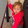 Belladonna June is registered to the contest to win money with this photo: child, toddler, baby, red_hoodie, hoodie, carpet, table, couch, outlet, wall, sitting, squatting, hand_on_table, blue_eyes, brown_hair, pony_tail, indoor, living_room, cute, casual_clothing