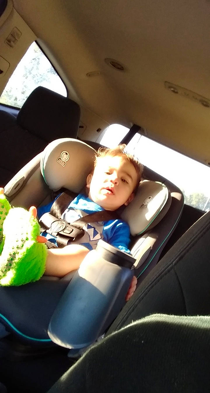 Micheal is registered to the contest to win money with this photo: auto_part, automotive_design, automotive_exterior, car, car_seat, car_seat_cover, comfort, family_car, head_restraint, luxury_vehicle, motor_vehicle, person, personal_luxury_car, seat_belt, steering_part, steering_wheel, sunglasses, toddler, vehicle, vehicle_door