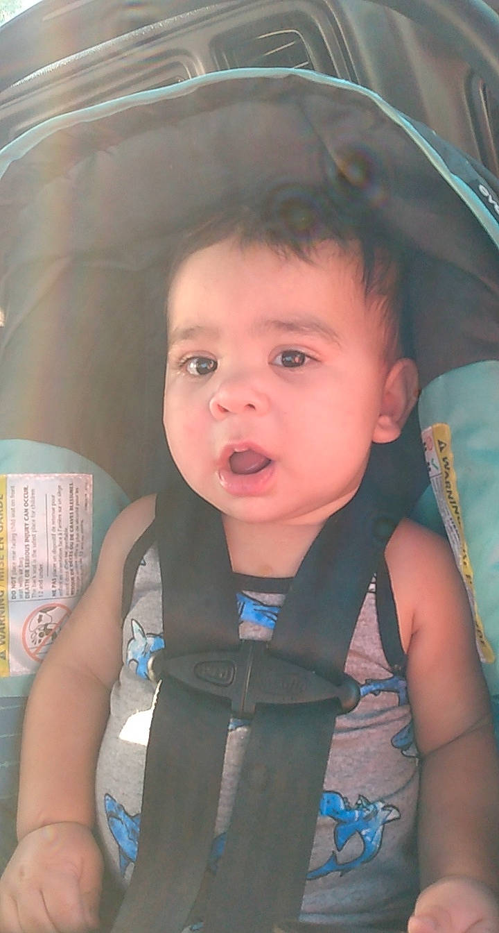 Micheal is registered to the contest to win money with this photo: baby, baby_carriage, baby_products, blue, chair, cheek, child, electric_blue, eyebrow, eyelash, facial_expression, fashion_accessory, fun, happy, iris, lip, mouth, nose, person, skin