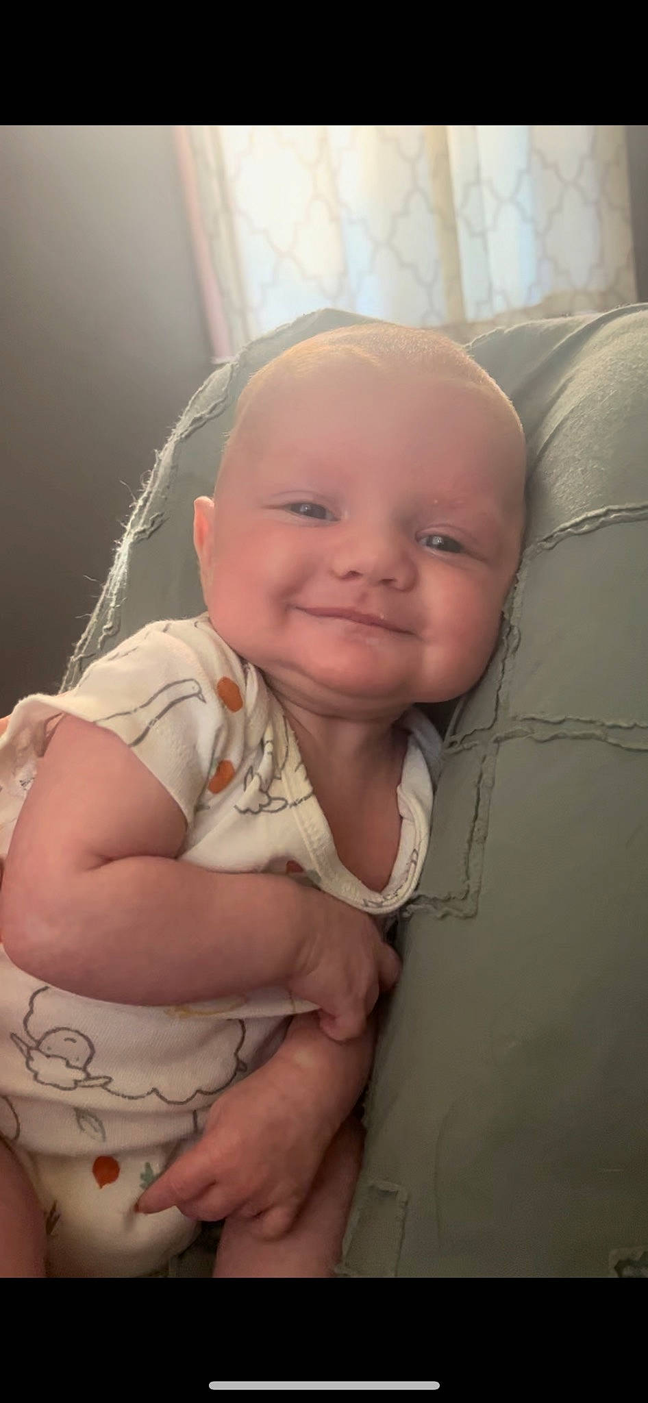 Myles is registered to the contest to win money with this photo: baby, cheek, chin, comfort, ear, eye, eyebrow, facial_expression, gesture, hairstyle, head, human_body, iris, joy, lip, mouth, nose, person, skin, sleeve